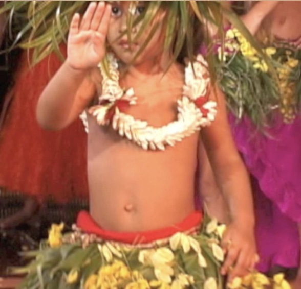 An image of one Tahitian toddler dancing