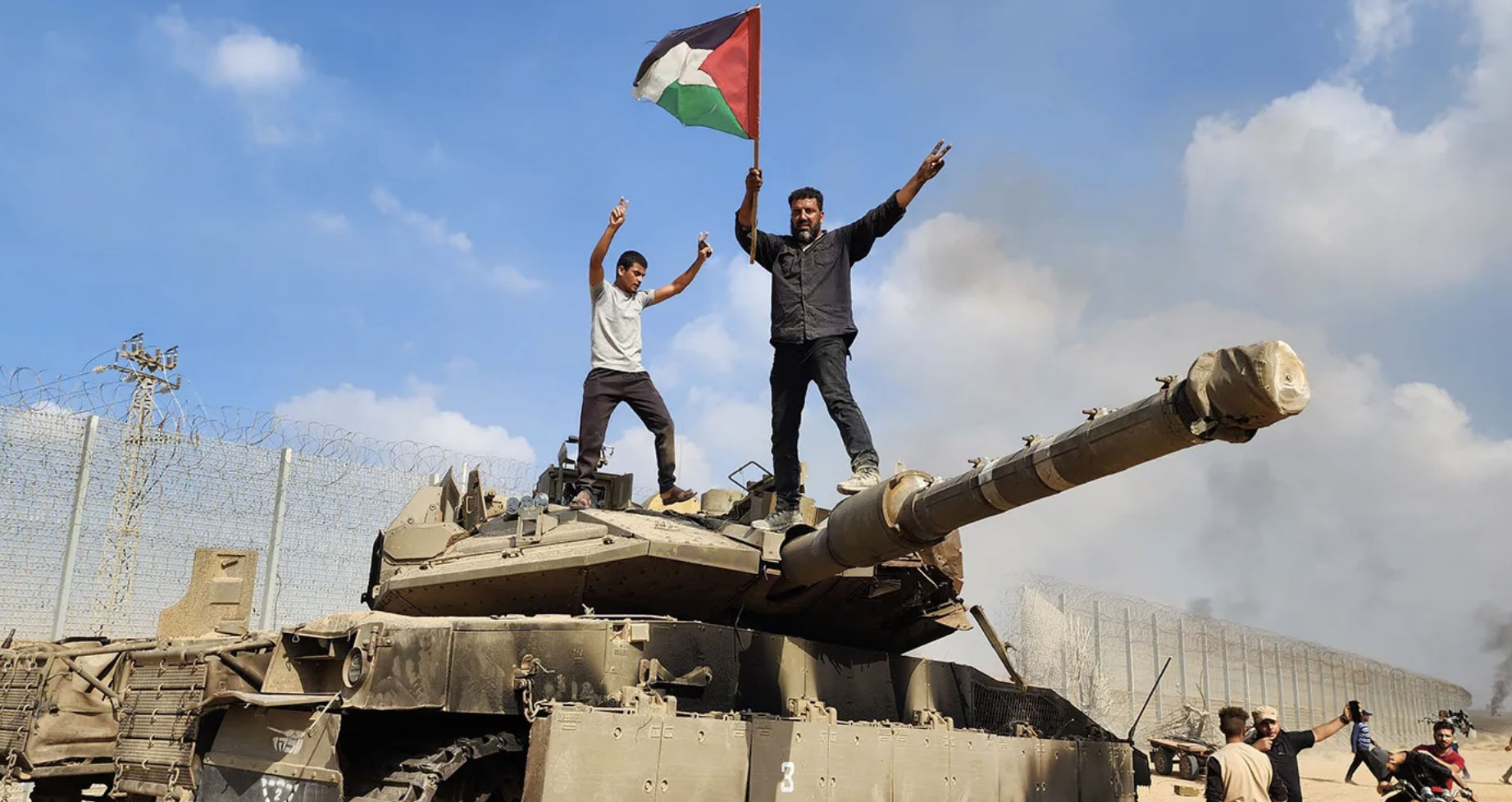 Hamas cheer & hold Hamas flag after invading Israel