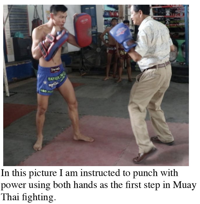 The author, Marcel, getting kick boxing lessons from a trainee