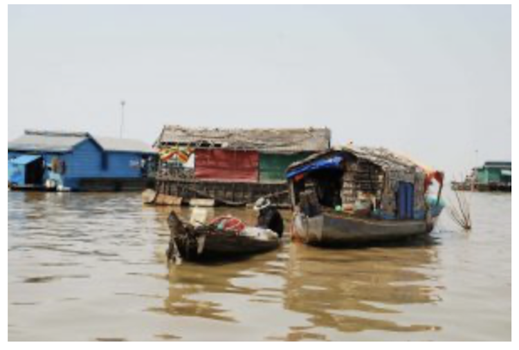An image of community house boats occupied by Vietnamese in Tonle Sap Lake in Cambodia