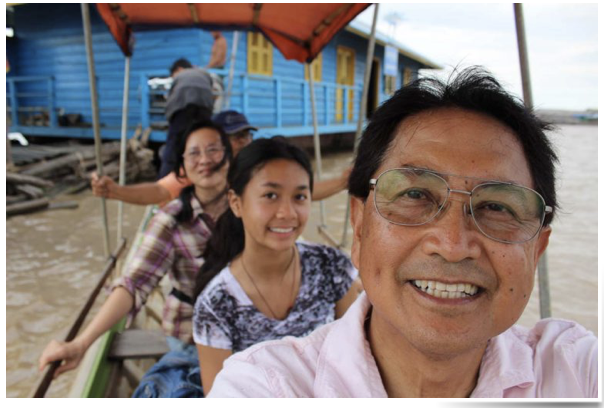 An image of my family visiting a community of Vietnamese houseboats in Tonle Sap Lake in Cambodia