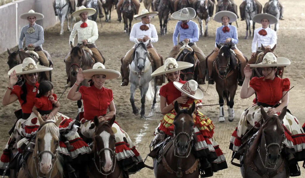 An image of men and women dressed charred for the Mexican National Charro parade held every September in Guadalajara